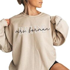 [Introduction] This classic crewneck sweatshirt features ribbing on the collar, hem, and cuffs to keep you warm. Double-needle stitched neckline, bottom hem, and sleeves shirt. Package includes 1 sweatshirt. [Gift perfect] Looking for the perfect sweater for your loved ones? Look no further! This awesome Custom Sweatshirt is a comfortable, affordable way to express yourself. Whether purchasing for anyone you can be sure to put a smile on their face [Customization] You can easily make your own sh White Bride Sweatshirt, Bridal Party Sweat Suits, Bridesmaid Sweatsuit, Bride And Groom Reception Outfit, Bridesmaid Sweatshirts, Bridal Apparel, Wifey Sweatshirt, Mrs Sweatshirt, Reception Outfit