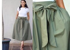 Make this gorgeous green poplin skirt your confidante to seize the day stylishly! Wear it as an everyday wear, a travel wear, a work wear, an office wear, a summer or fall skirt, a vacation wear, and even a holiday wear. The olive green midi skirt with wide belt is great for many different seasons and occasions. This is a safari skirt for women and teen girls. Made with a lush cotton poplin fabric, the olive skirt comes with an A-line silhouette, a smock waist, a wide hem, pleats, two pockets, and a detachable belt in matching color.  It is a small skirt to plus size skirt: ~~ modest mid calf length: 80 cm / 31.5 in (Want a custom length skirt? Message us!) ~~ elastic waist band fits comfortably from 66 to 102 cm / 26 to 40 in This khaki skirt is modeled by a 1.65 m tall woman Easy Care Th Safari Skirt, Green Skirt Outfits, Midi Skirt With Belt, Skirt Outfit Summer, Modest Casual, Green Midi Skirt, Bridesmaid Skirts, Poplin Skirt, Olive Skirt