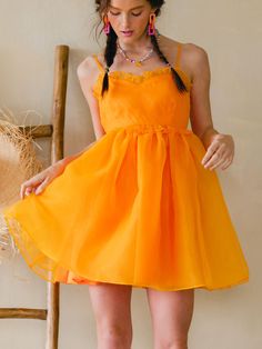 We are obsessed with the Clementine Organza Mini Dress!! Bengals season—but make it fashion! This puffy dress is so SO cute and sure to make you a stand out in any room! You will rock this! 100% Polyester Orange Flirty Dress With Spaghetti Straps, Flirty Orange Dress With Spaghetti Straps, Flirty Orange Dresses With Spaghetti Straps, Flirty Orange Spaghetti Strap Dress, Cute Orange Sleeveless Dress, Trendy Orange Dress For Brunch, Cute Orange Ruffled Dress, Cute Orange Mini Dress, Orange Sundress Mini Dress For Party