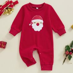 Dress your little one in the perfect holiday ensemble with our HAPPY SANTA Fleece Jumpsuit. Made from dashing red fleece and embroidered with Santa details, it's an adorable and comfortable choice for spreading holiday cheer. Get ready for lots of compliments on your child's festive look. Red Winter Onesie For Playtime, Red Onesie For Playtime In Winter, Cute Red Onesie For Loungewear, Red Long Sleeve Onesie, Long Sleeve Cotton Onesie For Holiday, Cotton Long Sleeve Onesie For Holiday, Holiday Long Sleeve Onesie, Long Sleeve Holiday Onesie, Red Cotton Long Sleeve Onesie