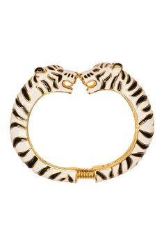 This statement bracelet will tap into your inner animal instincts. Youll be seeing double for days with this striking black and white enamel hinged gold plated bracelet.    Gold plated Black and white enamel Double tiger heads 2 1/4 inside diameter expands to 2 1/2 inches Spring hinge From the Kenneth Jay Lane Costume Jewelry Collection Featured in Shape/July-August 2018 Tiger Bracelet, Tiger Jewelry, Seeing Double, Gold Plated Bracelet, Costume Collection, Tiger Head, Stacked Jewelry, White Tiger, Gold Plated Bracelets