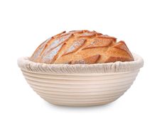 a loaf of bread in a bowl on a white background