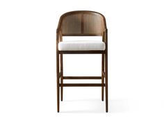 an upholstered wooden bar stool with a white cushion on the seat and back