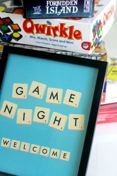 the game night welcome sign is displayed in front of some board games