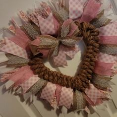 a wreath made out of fabric and burlocks