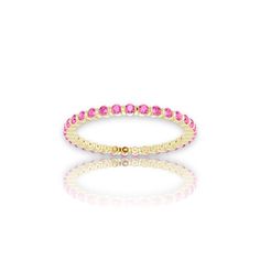 Pink Sapphire Eternity Ring Add an element of sophistication to your look with the addition of this stylish pink sapphire eternity ring. Perfect for layering with other rings or wearing on its own for a more minimalistic look. Either way, you will feel like a goddess! Beautiful sapphire stones highlight the piece in a serene shade of pink. This ring is custom-made to provide you with a fit tailored to you and your needs. Made with Solid 14k or 18k Gold Genuine Pink Sapphire Most of our jewelry is individually made to order, please allow 1-3 weeks for delivery. Ring Stacks, Sapphire Eternity Ring, Sapphire Stones, Luxury Jewelry Brands, A Goddess, Modern Ring, Sapphire Stone, Ring Collections, Elegant Jewelry