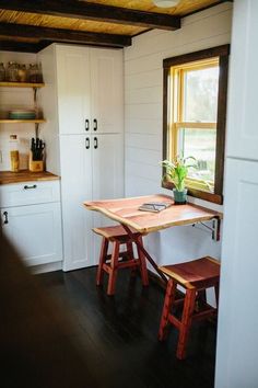 the small kitchen is clean and ready to be used as a dining room or office