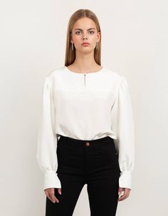 This silk crepe blouse with our signature puff sleeves and front key-hole detail is a must have in your wardrobe. It's an exclusive feminine staple pieces which you easily combine with all your skirts and trousers already hanging in your wardrobe. It's our most versatile piece and you can literally wear it during all occasions. This piece is crafted with love for detail and has fabric covered button closure in front as well on the puff sleeve cuffs. The back is longer than the front and the heml Chic Puff Sleeve Top With Lantern Sleeves For Daywear, Chic Lantern Sleeve Puff Top For Daywear, Chic Viscose Tops For Business Casual, Modern Blouse For Workwear, Modern Blouse For Work, Chic Daywear Puff Sleeve Top With Bishop Sleeves, Chic Bishop Sleeve Puff Sleeve Top For Daywear, Chic Puff Sleeve Top With Bishop Sleeves For Daywear, Chic Puff Sleeve Top With Balloon Sleeves For Daywear