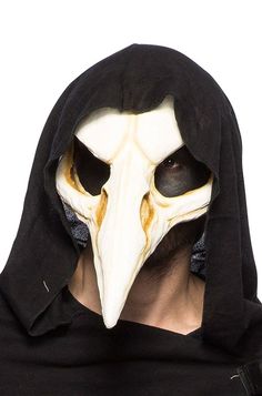 a man wearing a mask with a bird's head on it and a hood over his face