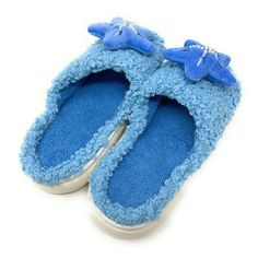 With their starfish motif and beachy vibes, these soft and cozy slides transport you to the tranquil shores with every step. Enjoy these super soft women's novelty slip-on slides from our partners at Oooh Geez! Slippers. Stay warm & look great with your new startfish themed blue fuzzy hard sole slides. Wear them around the house or out and about thanks to the non-skid rubber bottom. Pick up a pair today! Info Style: Sherpa slides with non-skid rubber bottom sole. Size: Small fits women's U.S. sh Synthetic Indoor Slippers For Summer, Soft Slip-on Summer Slippers, Indoor Summer Slide Slippers, Comfortable Blue Slide Flip Flops, Soft Flat Slippers For Summer, Soft Synthetic Slippers For Summer, Soft Flat Summer Slippers, Soft Synthetic Summer Slippers, Blue Non-slip Slippers For Vacation