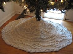 a christmas tree skirt is on the floor