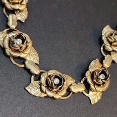 You never know what unique and unusual treasures you will find when you visit my shop! Inventory changes daily to weekly. Vintage Rose Choker, Rhinestone Choker, Flower 16 Inch Choker Box Clasp This would make a great "something old" for a wedding ceremony! The gold on the chain is a little bit faded. The roses and rhinestones are in good condition. Ships from California. == SHIPPING == Ships from California. Most orders ship within 1-3 business days. Orders from my shop totaling $35 and over qu Vintage Flower Necklaces For Formal Occasions, Vintage Flower Shaped Jewelry For Party, Vintage Flower Jewelry For Party, Vintage Flower Necklace For Formal Occasions, Vintage Rose Design Jewelry For Formal Occasions, Vintage Flower Necklaces For Anniversary, Vintage Rose Design Jewelry In Rose Color, Vintage Rose Design Jewelry, Metal Rose Design Jewelry For Wedding