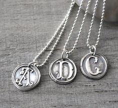 "Personalized Silver Wax Seal Initial Necklace - Fine Silver Custom Initial Charm with Sterling Silver Ball Chain This pendant is gorgeous and has such a great silver feel! The pendants are beautifully handcrafted and not machine cut, and each one has an organic handcrafted look and every letter is unique. This listing is for **ONE personalized initial necklace** with your choice of letter. ● CUSTOMIZED for you with *ONE* LETTER of YOUR CHOICE (A - Z) ● Please leave your choice of letter in the Symbolic Engraved Initial Pendant Jewelry, Elegant Silver Initial Pendant Custom Necklace, Elegant Silver Initial Pendant Necklace, Elegant Silver Custom Necklace With Initial Pendant, White Gold Sterling Silver Initial Pendant Charm Necklace, Nickel-free Sterling Silver Medallion Necklaces, Classic Silver Medallion Jewelry, Handmade Pendant Jewelry For Anniversary Gift, Classic Handmade Jewelry With Round Pendant