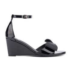 Textured bow details add a feminine twist to the shelby sandal, featuring a wedge heel. With a polished buckle closure on the ankle strap, it pairs perfectly with a sleek sheath dress. Closure Type: BuckleShoe Heel Height: 3 InchesUpper/Outer Base Material: 100% LeatherShoe Lining Material: LeatherSole Material Content: 100% RubberToe Type: Open Toe, Pointed ToeShoe Strap Type: Ankle StrapHeel Style: Wedge HeelCountry of Origin: Imported Elegant Wedge Sandals With Buckle Closure And Round Toe, Summer Patent Leather Heels With Bow, Summer Bow Heels In Patent Leather, Elegant High Heel Wedge Sandals With Buckle Closure, Elegant Wedge Sandals With Buckle Closure For Spring, Elegant Spring Wedge Sandals With Buckle Closure, Elegant Ankle Strap Wedge Sandals With Buckle Closure, Formal High Heel Wedge Sandals With Buckle Closure, Formal High Heel Wedge Sandals With Buckle