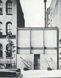 an old black and white photo of a building