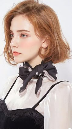 a woman wearing a black and white bow tie