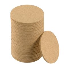 several round cork coasters stacked on top of each other in front of a white background