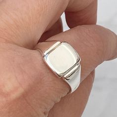 New in!  Made to order. Please allow 3 weeks before being ready to post.  Solid silver cushion signet ring- mirror polished finish  Ring sizes available - J to X - 4 3/4 - 11 1/2 # Hand engraving available #  Please contact for a quote!  Face size - 13mm x 10.5mm  Weight - 7g ( size x )  Hallmarked with this years mark Brand new condition!   The signet ring comes in a lovely vintage style ring box! Please make contact if you have any questions regarding the item! Follow Heirlooms & Signets on Instagram for the latest updates - https://www.instagram.com/heirloomsandsignets/ Thank You Hannah Silver Cushions, Vintage Style Rings, Mens Silver Rings, Ring Sizes, Hand Engraving, Ring Box, Signet Ring, Vintage Stil, New Vintage