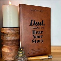 a book with a lit candle next to it