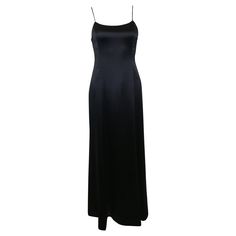 - Vintage Chanel black silk maxi dress from 1995 A/W collection. - Slim spaghetti strap. - Slim fit close to the body with A - shape bottom. - Backless with zip closure. - Size 42. - 100% Silk. Lining: 100% Silk. Black Satin Floor-length Slip Dress, Black Bias Cut Maxi Dress With Spaghetti Straps, Full-length Satin Slip Dress For Evening, Full Length Satin Slip Dress For Evening, Black Maxi Dress With Bias Cut And Spaghetti Straps, Black Maxi Dress With Spaghetti Straps And Bias Cut, Black Floor-length Slip Dress For Formal Occasions, Evening Satin Lined Maxi Dress, Evening Satin Maxi Dress With Lining