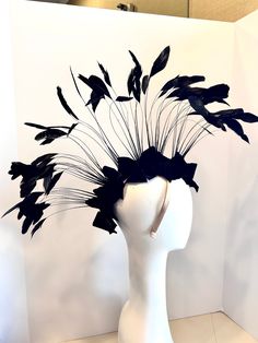 Black fascinator- Mohawk- Music festival- Fashion headdress  Hello,    This headpiece has burn out black feathers that just have the tip of the feathers still on the bone. I made velvet bows at the base, 10 in all. Four on each side, and one in the front and one in the back. The base has wire in it, so it's adjustable to fit anyone's head. The headband is  adjustable and so is the mohawk so adjust to your head size plus  it stay on your head while you dance!  I can in any color to match your hair. This headband is very comfortable. If you have any questions please ask me. ------------------------------------------------ Another unicorn style: https://www.etsy.com/listing/522977148/mohalk-headpiece-mohawk-headdress-black ------------------------------------------------ I ship US Postal Serv Headpiece Ideas, Black Headpiece, Gold Masquerade Mask, Black Velvet Bow, Black Bows, Velvet Bows, Mohawks, Black Fascinator, Bride Hat