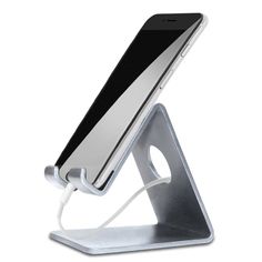 an image of a cell phone charging in a holder on a white background with clippings