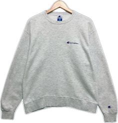 Basic Gray Crew Neck Sweater, Classic Crew Neck Winter Tops, Classic Winter Crew Neck Tops, Gray Crew Neck Winter Tops, Classic Gray Crew Neck Sweatshirt, Winter Heather Grey Crew Neck Top, Gray Crew Neck Top With Embroidered Logo, Classic Crew Neck Tops With Letter Print, Heather Grey Crew Neck Top For Winter