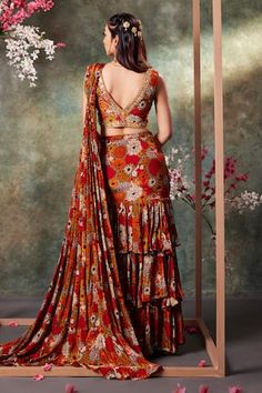 Orange pre-draped ruffle tiered saree with all over bloom print. Paired with a matching print hand embroidered V neckline padded blouse. - Aza Fashions Tiered Saree, Saree Gowns, Dhoti Saree, Cotton Sarees Handloom, Ruffle Sarees, Rhea Kapoor, Ruffle Saree, Padded Blouse, Drape Saree