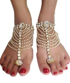 Bollywood Indian Bridal Wedding Pearl Gold Plt Kundan Stone Chain Pair Anklets Anklet Payal Belly Dance Boho Jewelry for women Courier-Ship Pair Of Ethnic Traditional Jewelry Anklet / Payal Shipping by UPS Private Courier with tracking Size:- 28cm/11inch Delivery time 10-12 days You will receive a pair of these anklets. Hand Crafted From Finest Alloy by Skilled artisans of India Really Beautiful, Light weight And Very Comfortable Elegant and Traditional Condition : Brand New ------------- Traditional Gold Beaded Anklets, Elegant Stone Work Anklets For Wedding, Adjustable Traditional Anklets For Party, Elegant Stone Work Anklets For Festive Occasions, Wedding Anklets For Diwali With Tilla Detail, White Toe Ring Anklets For Festivals, Wedding Diwali Tilla Anklets, Elegant White Festive Anklet, Elegant Gold Anklets For Puja