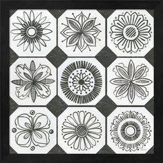 black and white flowers are arranged in the shape of hexagonals on a gray background