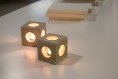 two lit up blocks sitting on top of a table