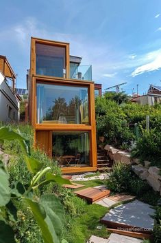 the house is made out of wood and glass