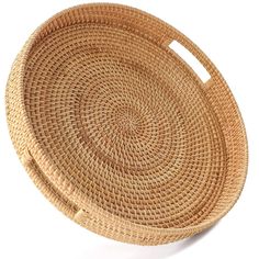 a round woven basket on a white background