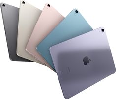 four different colored ipads sitting side by side in front of each other on a white background