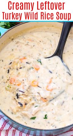 creamy leftover turkey wild rice soup in a bowl with a black spoon on top