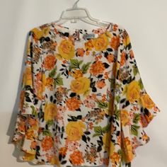 Kasper 100% Polyester Top - Blouse - Shirt White Background Floral Design Size Petite Extra Large (Pxl) Petite Plus Size New Without Tags The Flower Details Are Tangerine, Yellow, Peach, Black, Tan And Green. Set In Bell Sleeves - 3/4 Length- Ruffle Cuff Boat Neckline With Keyhole Back One Button Closure Measurements- Front Armpit To Armpit - 24” Back Armpit To Armpit- 24” Length - 25” Sleeve Length - 16” This Top Can Be Worn To Dress Up Or Dress Down. Pair With Jeans, Dress Pants, Trousers, Ski Trendy Printed Yellow Blouse, Trendy Yellow Printed Blouse, Trendy Orange Spring Blouse, Trendy Orange Blouse For Spring, Yellow Summer Printed Blouse, Yellow Printed Summer Blouse, Orange Spring Vacation Shirt, Orange Vacation Shirt For Spring, Spring Vacation Orange Shirt