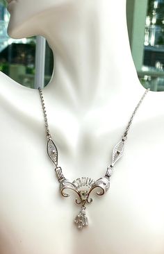 "This very feminine chain necklace is signed by Ann Lee. A timeless design with swirl and clear barrette rhinestones. the full length of the necklace is 16.50\", the center piece is 1.5\" tall, 1.5\" wide. Marked on the marked \"Ann Lee sterling\". The clasp works smoothly. In excellent condition with minor, expected signs of wear off. The center rhinestone has a very light yellow tone. Comes in a gift box, pack with care." Yellow Tone, Earring Box, Yellow Tones, Chain Ring, Clear Rhinestones, Light Yellow, Chain Styles, Spring Rings, Timeless Design