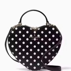 6.9"H X 8.3"W X 2.2"D Handle Drop: 2.5" Strap Drop: 22" Saffiano Pvc Ksny Metal Pinmount Logo Two Way Spade Jacquard Lining Interior Front Slip Pocket Zip Around Closure Kate Spade Heart, Heart Purse, Kate Spade Crossbody Purse, Heart Bag, Chain Crossbody Bag, Purim, Kate Spade Purse, Crossbody Clutch, Crossbody Wallet