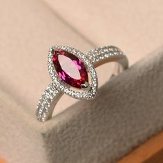 This ring features a 5*10 mm marquise cut lab ruby ,and sterling silver finished with rhodium. Customization is available. It is made by hand, and it will take about 7 days to finish the ring after your payment is completed. Main stone: lab ruby Main stone weight: Approx 1.34 ct Metal type: sterling silver finished with rhodium Accent stone: cz Customization is available, I also can make it with 14k solid gold (white or yellow or rose) and diamond accent stone, just feel free to contact me. Any Ruby Ring Silver, Red Ruby Ring, Bff Jewelry, July Birthstone Ring, Blue Gemstone Rings, Cute Engagement Rings, Colored Stone Rings, Ring Ruby, Ring Marquise