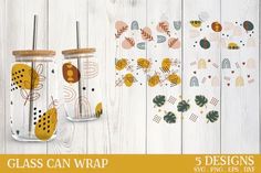 the glass can wrap is designed with gold and black dots, leaves, and circles