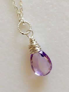 Lovely genuine amethyst pear briolette in Rose de France lilac pink color. Wire wrapped in Sterling silver on delicate Sterling silver cable chain with spring ring clasp. Luxe AAA faceted gemstone is 13 x 8mm. Also available in 14k good fill. Beautiful spring color! Clear Crystal Necklace, Lapis Necklace, Lilac Pink, Jewelry Design Inspiration, Beaded Jewelry Designs, February Birthstone, Pink Gemstones, February Birth Stone, Custom Bracelets