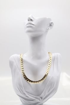 The Gold Cuban Link Necklace features thick, tightly interlocking links in polished gold, delivering a bold and luxurious statement. Its timeless design exudes elegance and sophistication, making it a versatile piece for both casual and formal occasions. Length: 17” Closure: Spring Ring Material: Brass with 18K Gold Plating with Rhodium Coating Lead Free and Hypoallergenic Elegant Cuban Link Necklace With Chunky Chain, Elegant Cuban Link Necklace With Chunky Chain For Gift, Formal Chain Link Necklace, Gold Oval Link Chain Necklace For Party, Elegant Gold Chain Necklace With Solid Link, Classic Yellow Gold Chain Necklace For Party, Elegant Chunky Cuban Link Chain Necklace, Classic Yellow Gold Party Chain Necklace, Elegant Gold Plated Cuban Link Necklace