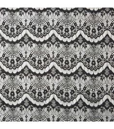 a black and white lace pattern on fabric