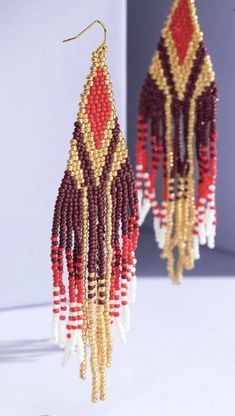 Dazzling seed bead fringe dangle drop earrings.APPROX. L 4.75" W 1.75" Seed Bead Fringe Earrings, Bead Fringe Earrings, Bead Fringe, Beaded Fringe Earrings, Buy Seeds, Red Burgundy, Beaded Fringe, Fringe Earrings, The Cool