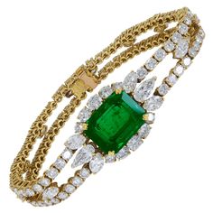 This amazing bracelet is embellished with a 9.50 carat Zambian emerald and 17.45 carats of white diamonds. Accompanied by a certificate from SSEF. Mounted in 18k yellow gold weighing 32.94 grams. Created by the French jeweler Andre Vassort, one of the most significant jewelers of the 20th century. Matching necklace is available for sale (sold separately). 1stDibs item reference: LU330212643922 Item Reference, Expensive Jewelry Luxury, Ruby Bracelet, Jewellery Indian, Emerald Bracelet, Antique Bracelets, Diamond Jewelry Designs, Bracelets Gold Diamond, Zambian Emerald