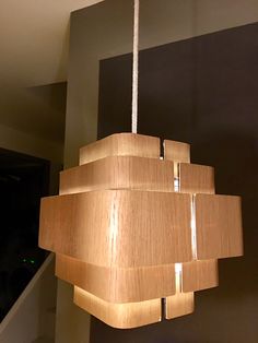 a wooden chandelier hanging from the ceiling