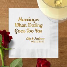 a napkin with the words marriage when dating goes too far on it next to a rose