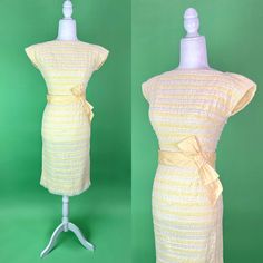 Party, brunch, or formal event - this adorable dress can do it all this spring! She's made up of stripes of smocked buttery yellow cotton alternating with stripes of white floral lace for a very textural experience! Wide yellow waistband with a giant bow for that extra 50s flair! * 1950s/60s * label: Jr. Flair * material: cotton, lace * size marked: none, fits like a modern XS (please see measurements) * back zipper closure * bow at waist * full lined * darts at bust and waist * approximate meas Formal Dress Spring, Vintage Easter Dress, White Lace Party Dress, Spring Cocktail Dress, Spring Cocktail, Giant Bow, Lace Party Dress, Cocktail Dress Vintage, Lace Party Dresses