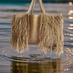 Introducing our stunning Fringed Straw Bag, the perfect accessory for your summer adventures! This handmade crocheted beach bag is completely hand-knitted using Natural paper rope raffia.  This Large Shoulder Bag is hand-woven with intricate details to create a one-of-a-kind piece. Ideal as a Shopping Bag or for a day at the beach, this Raffia Bag combines style and functionality effortlessly. Embrace the Boho vibes with this Crochet Tote Bag, suitable for any occasion. Whether you're into knitt Summer Rectangular Shoulder Bag With Fringe, Travel Crochet Shoulder Bag With Tassels, Beach Shoulder Bag With Tassels, Rectangular Shape, Casual Beach Bags With Fringe, Summer Fringe Rectangular Bag, Summer Fringe Rectangular Bags, Summer Rectangular Fringe Bags, Summer Straw Shoulder Bag With Tassels, Bohemian Bucket Bag With Tassels For Beach