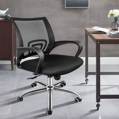 an office chair sitting in front of a desk